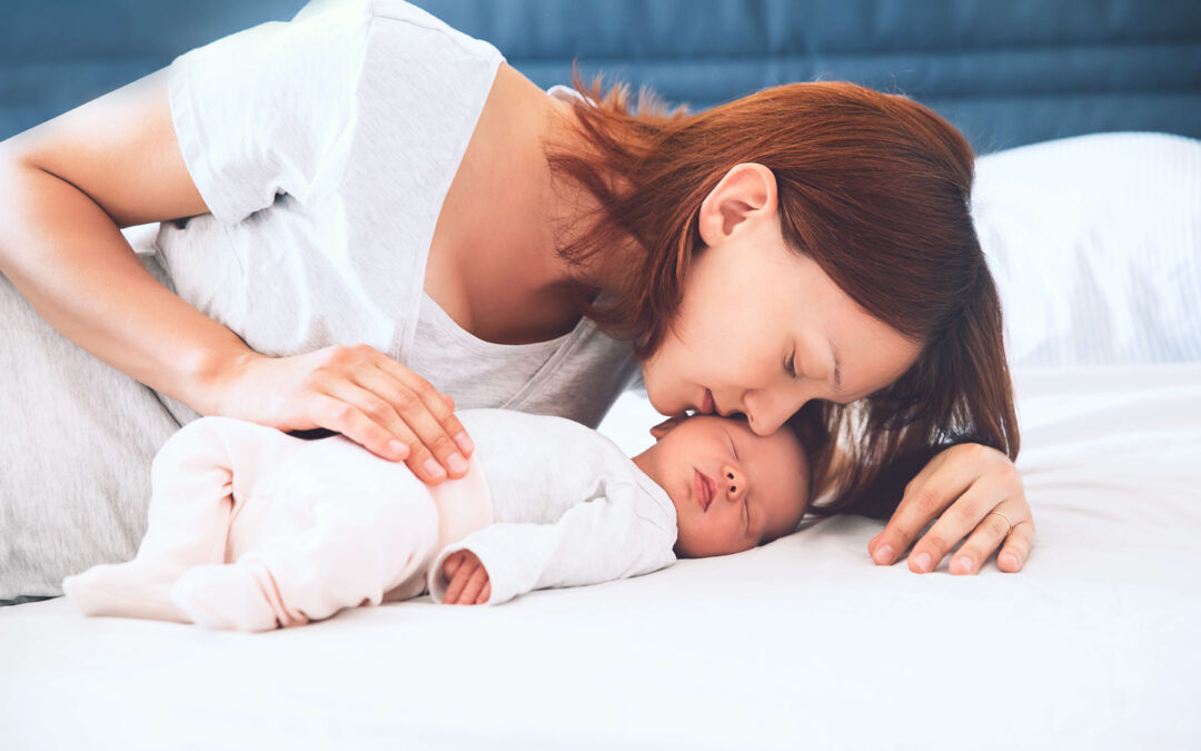 Mother Kisses Child